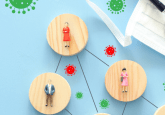 Wooden circles with images of various people on them, connected by black lines on a blue background. They are surrounded by red and green images of viruses. In the upper corner is a stethoscope resting on top of a white face mask. To represent that Clarivate and HealthWise Data partner to enhance RWD with SDoH.